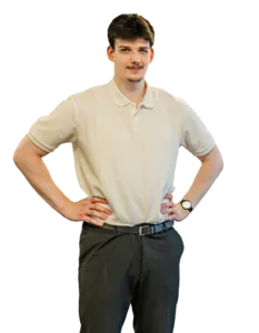 Modrá minimalistická ikona domečku s lupou, skrze lupu je vidět symbol dolaru.