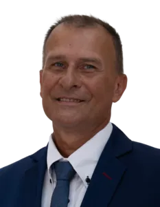 Modrá minimalistická ikona domečku s lupou, skrze lupu je vidět symbol dolaru.