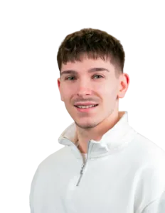 Modrá minimalistická ikona domečku s lupou, skrze lupu je vidět symbol dolaru.